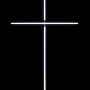 A glowing white cross on a black background.